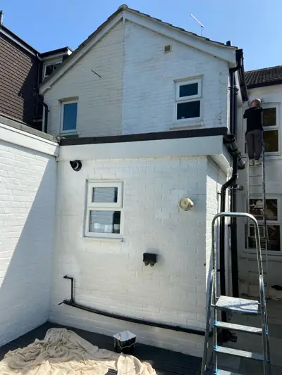 Rear of a house with freshly painted white render