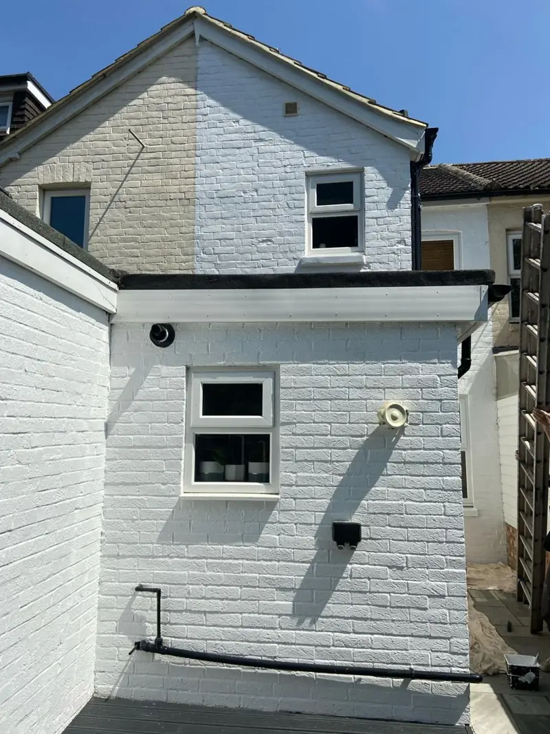 Rear of a house with freshly painted white render