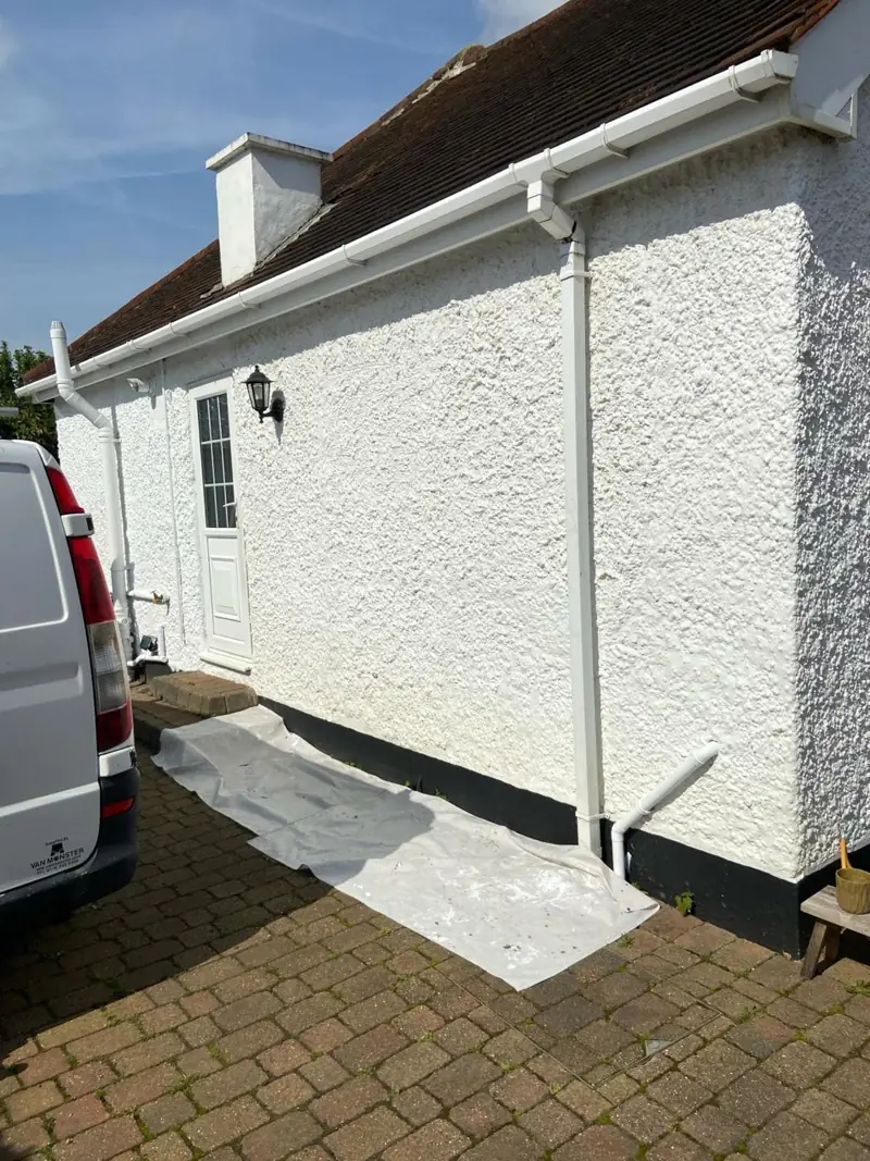 Freshly painted roughcast render wall