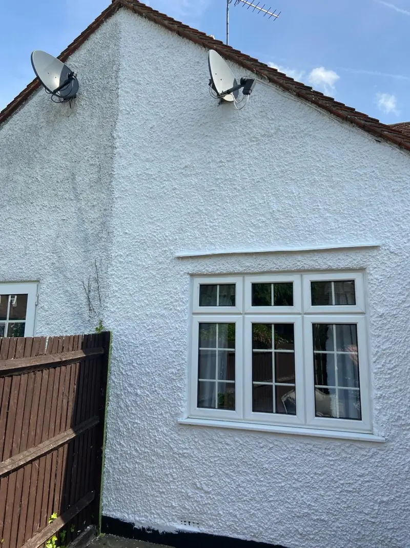 White render and window frames repainted