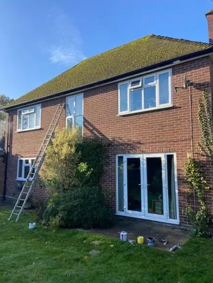 Brick house with exterior woodwork repainted