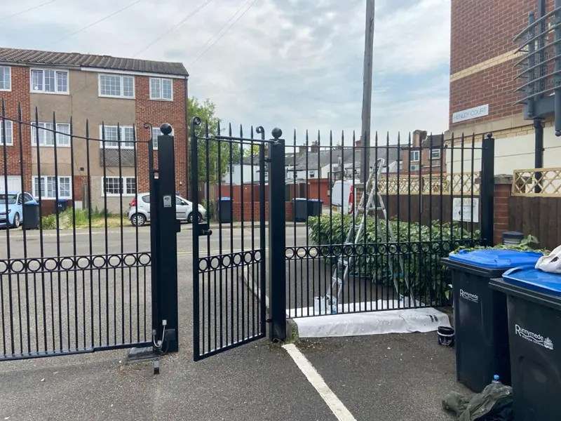 Black metal gates repainted