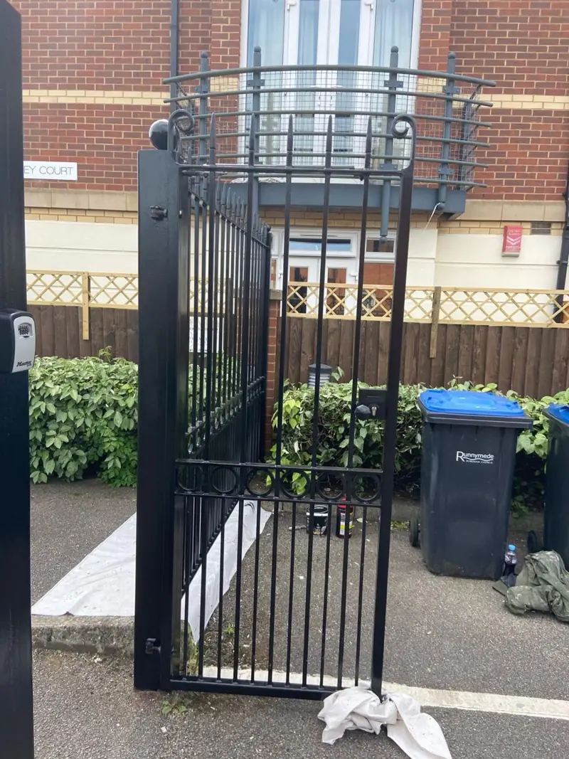 Black metal gates repainted