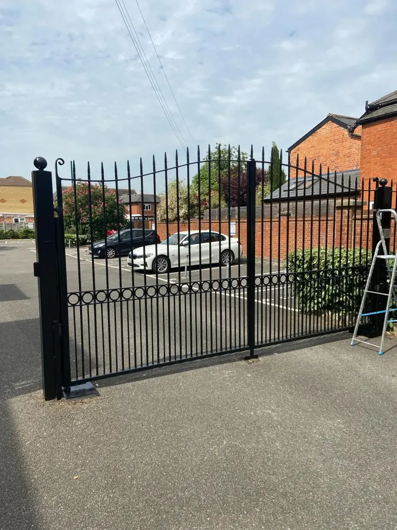 Black metal gates repainted