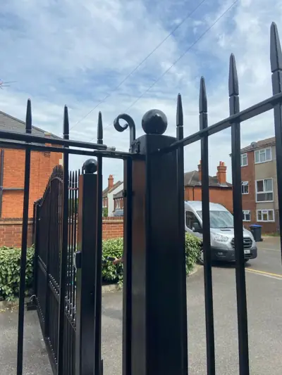 Black metal gates repainted