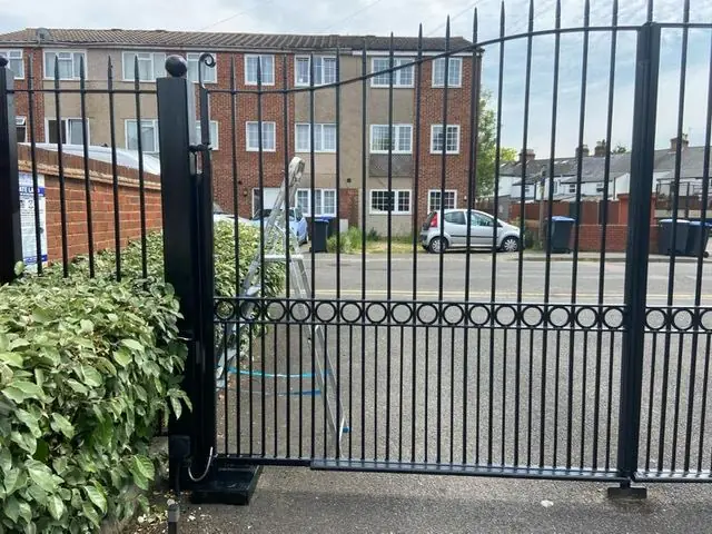 Black metal gates repainted