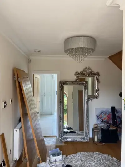 Hallway with chandelier and freshly painted walls