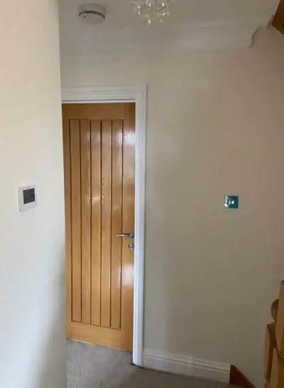 Oak door and freshly painted hallway