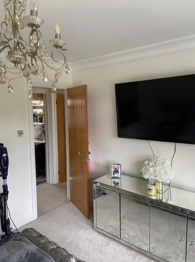 Living room decorated around a wall-mounted TV